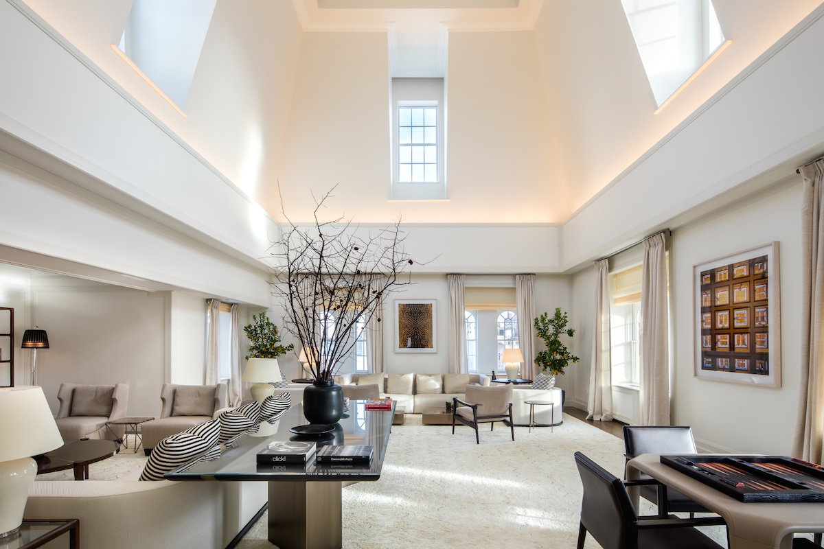 the-living-room-is-so-large-it-doubles-as-a-grand-ballroom-space-the-26-foot-high-ceiling-makes-the-room-feel-even-more-spacious